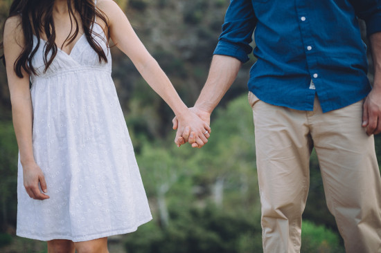 Couple holding hands expressing love in nature scene