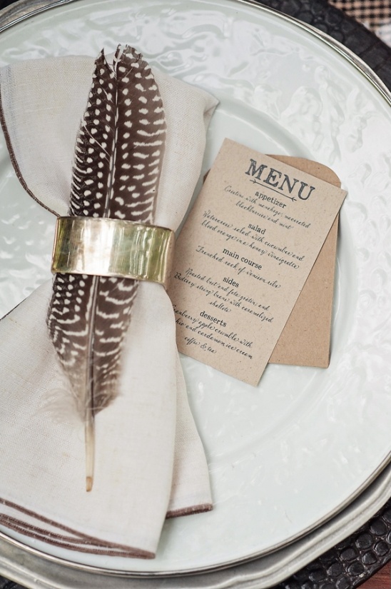 feather in a napkin ring holder