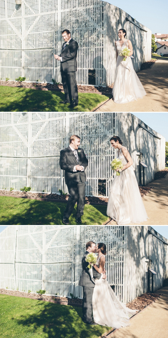 Happy groom surprised by bride first look wedding day kiss