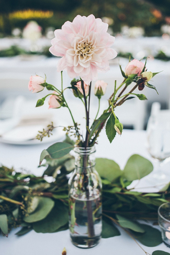 Light pink dahlia and rosebuds in vase centerpiece