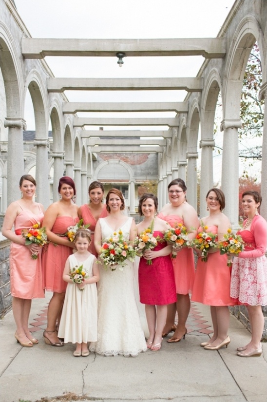 coral bridesmaids in assorted dresses