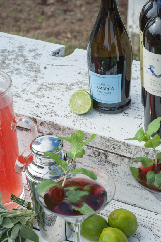 Festive drinks featuring prosecco lime and mint garnish