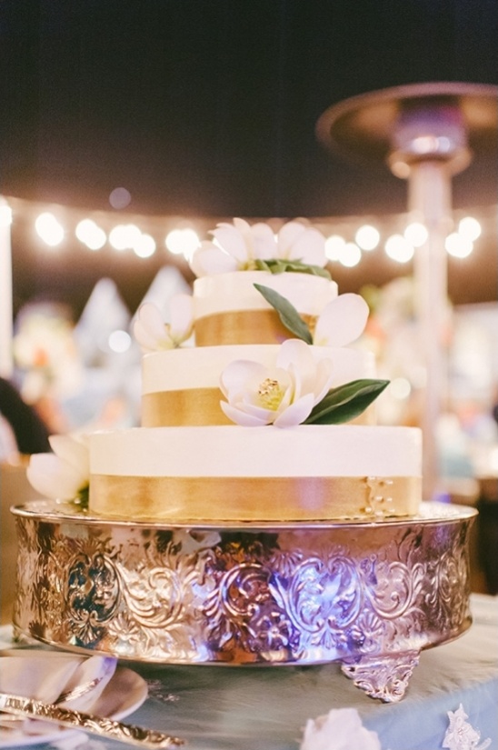 gold ribbon wrapped wedding cake