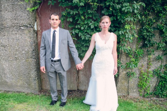 Happy couple holding hands on wedding day