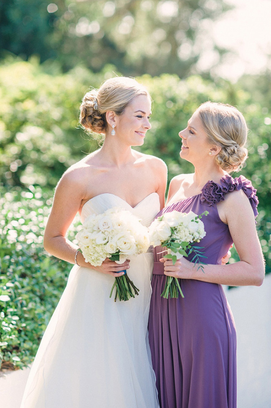 purple dresses and white bouquets