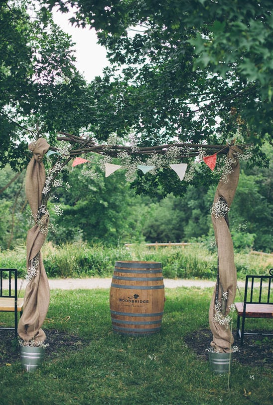 handmade wedding arch with brulap bunting and babys breath