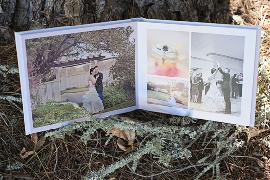 Wedding album open on the ground with couple and rings