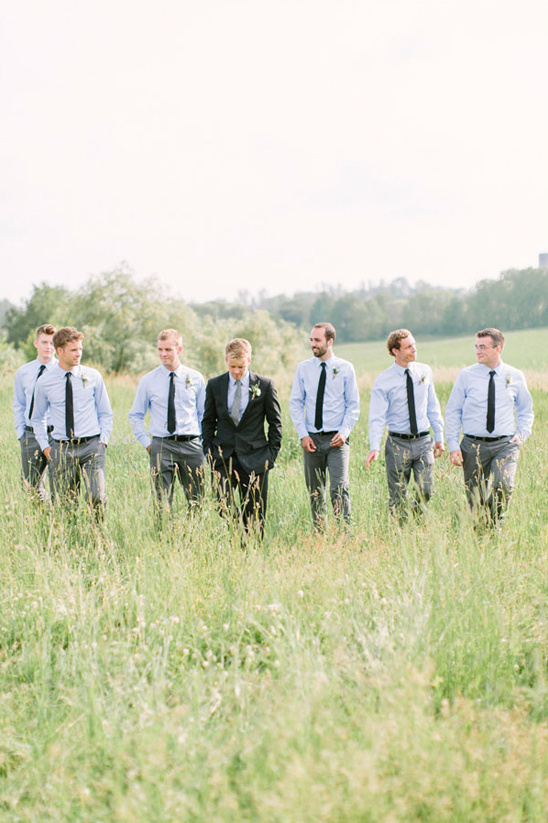 groomsmen in blue button downs and black ties