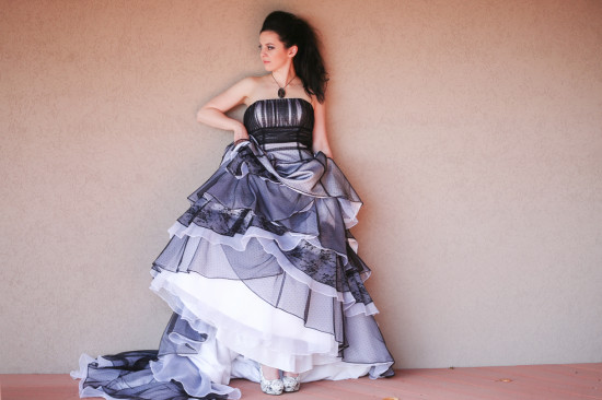 Elegant woman in a black and white tiered wedding gown