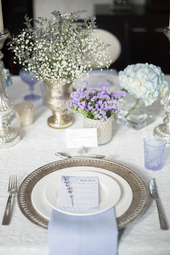 Elegant dining table setting with flowers and menu card