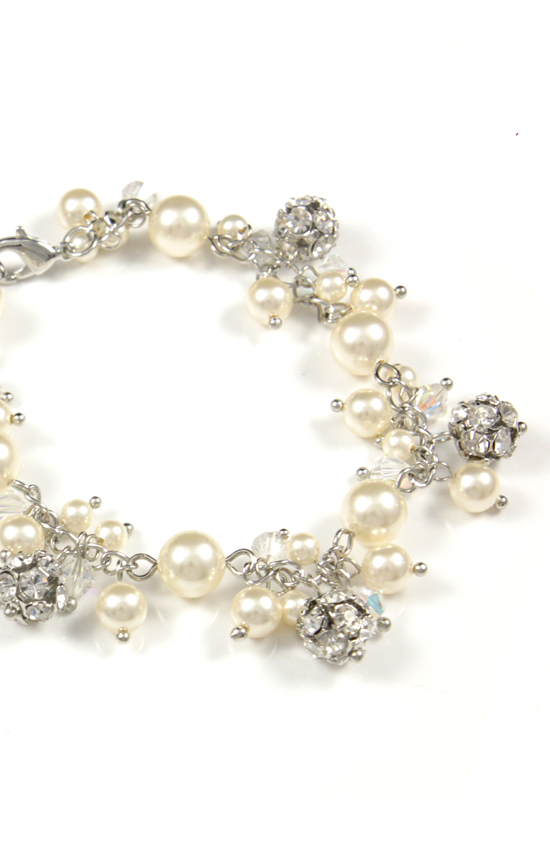 Elegant pearl bracelet with crystal accents on white background