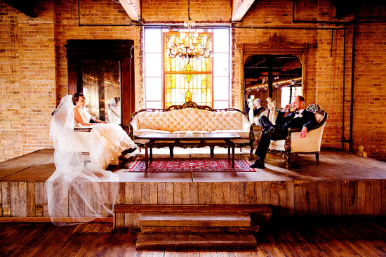 Bride and groom relaxed in a vintage venue on their wedding day