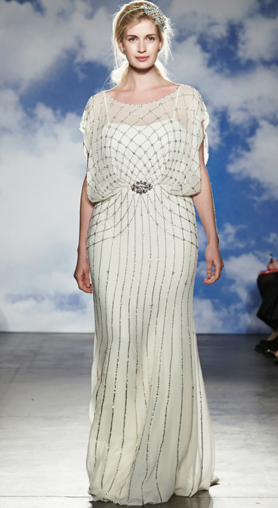 Elegant bride in a beaded wedding dress on the runway