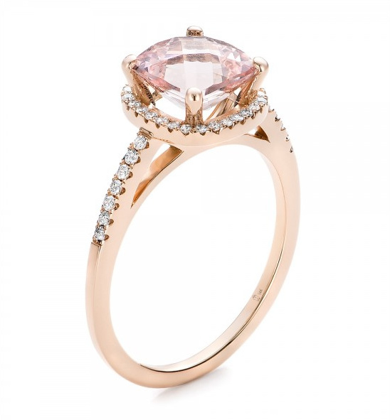 Rose gold ring with a pink gemstone and diamond accents