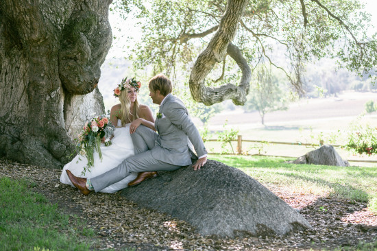 Romantic bride and groom wedding photoshoot under a tree