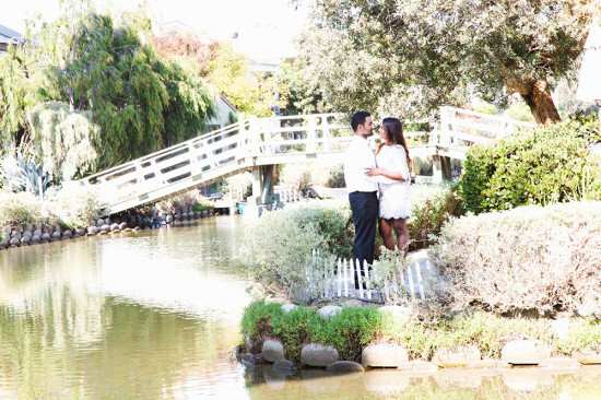 Romantic couple by bridge and canal Venice Beach CA