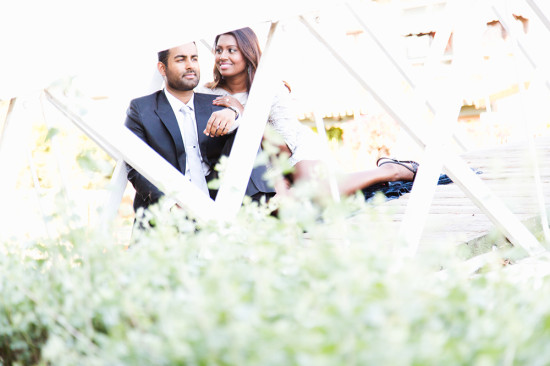 Romantic couple posing outdoors in bright sunlight