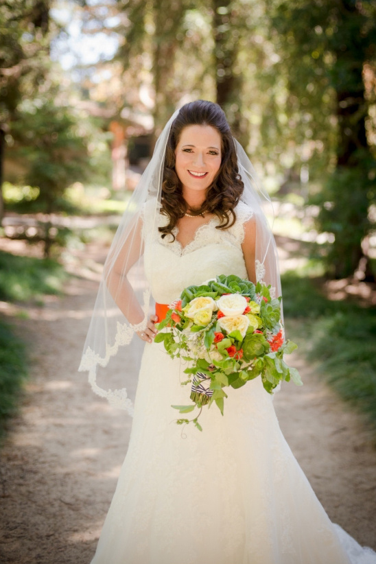 white bridal gown with orange sash