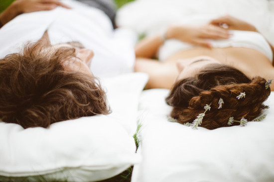 Couple relaxing on pillows, enjoying a peaceful moment together