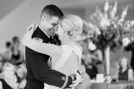 Happy couple dancing at their wedding in black and white