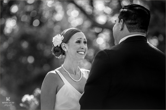 Bride's joyful expression during wedding ceremony, black and white photo