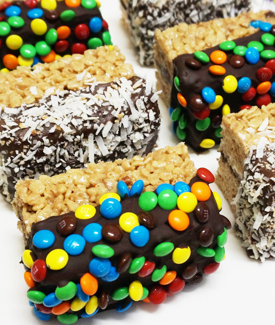 Delicious chocolate covered bars with M&Ms and coconut flakes