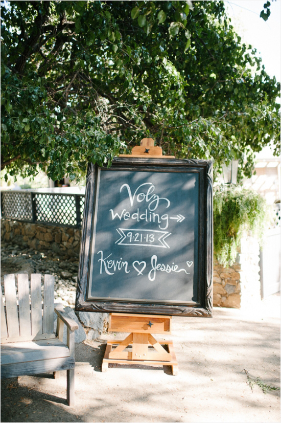chalkboard sign to let guests know where the wedding is