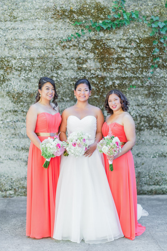 coral bridesmaid dresses with gold belts