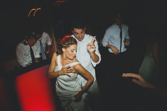 Bride and groom dancing and celebrating on the dance floor