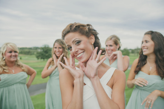 Bride and bridesmaids smiling happily on a wedding day