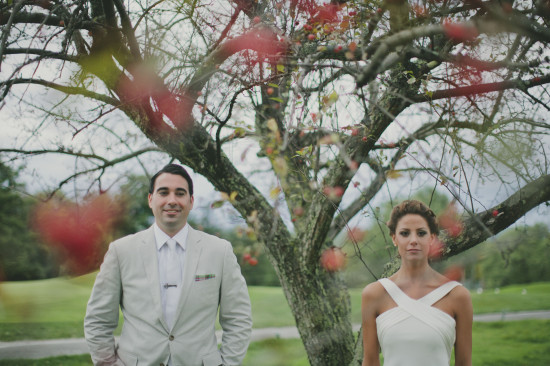 Bride and groom posing together in a beautiful garden scene