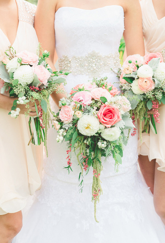 Bride and bridesmaids with pink and white bouquets