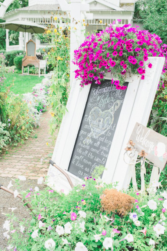 Elegant wedding sign with chalkboard and vibrant flowers