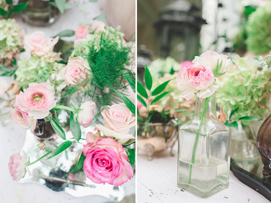 Pink roses and ranunculus floral arrangement in vases