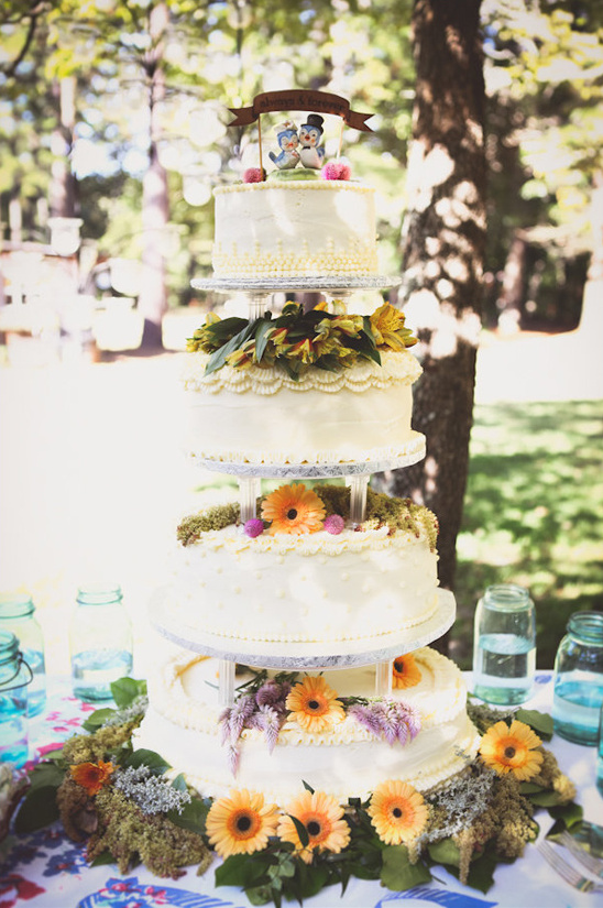 flower draped tiered wedding cake