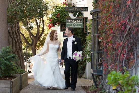 Bride and groom walking arm in arm on their wedding day