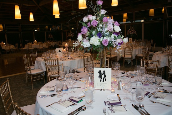 Elegant wedding reception with table settings and floral centerpiece
