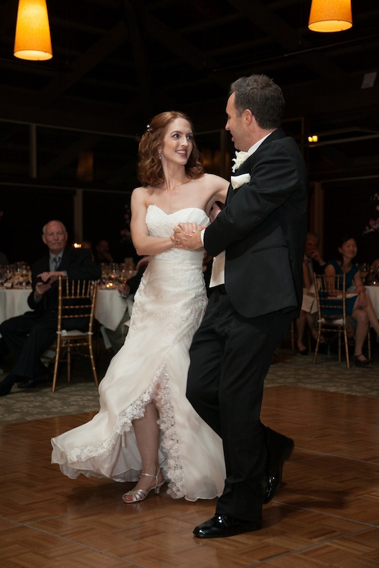 Bride and groom share a joyful first dance at a wedding reception
