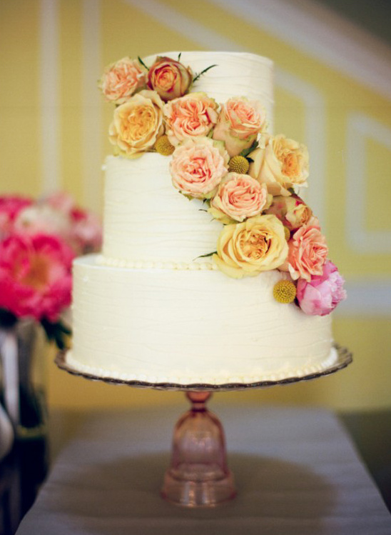 yellow and pink cascade flower wedding cake