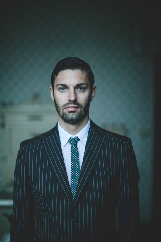 Man in pinstripe suit with patterned tie portrait