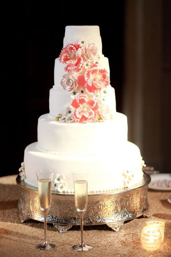 white tiered wedding cake with floral accents