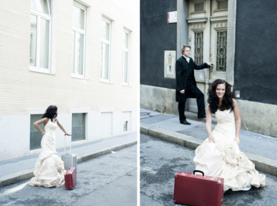 Bride with luggage and groom at door street scene wedding photo