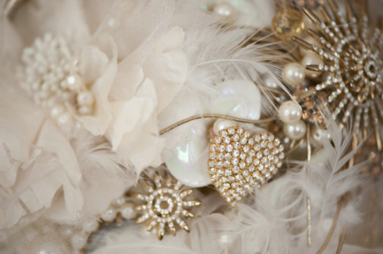 Elegant bridal bouquet with pearls feathers and gems