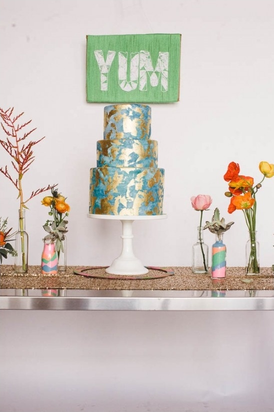 gold leaf wedding cake with DIY backdrop sign