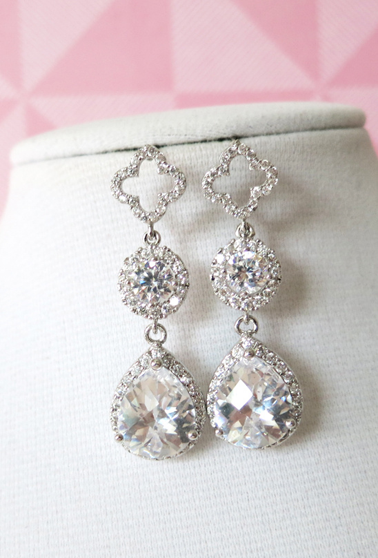 Elegant silver earrings with teardrop and flower shape details