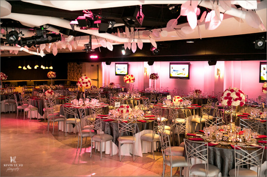 Elegant event space setup with tables and flowers