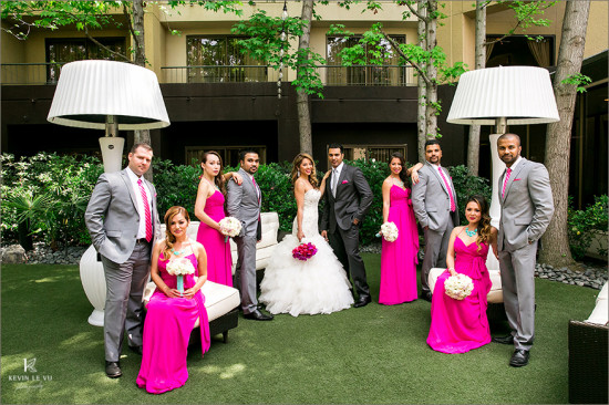 Wedding party with bride in white dress and pink dresses