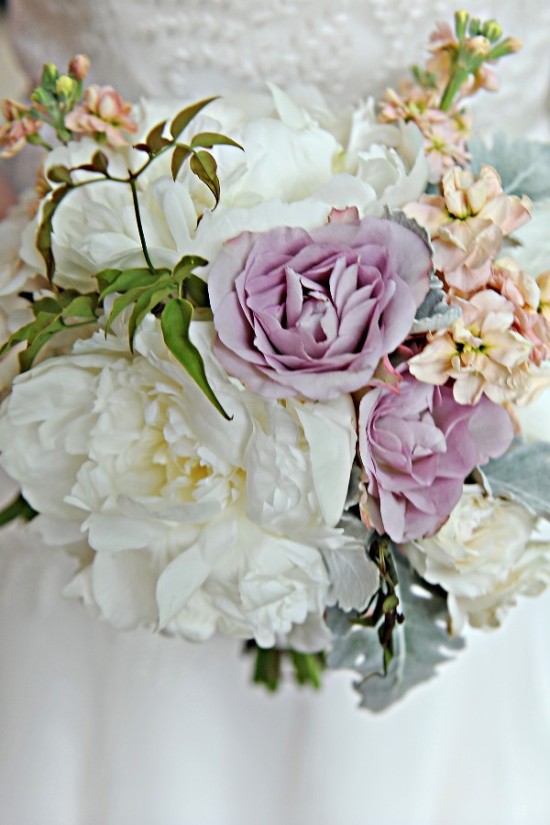 Elegant bridal bouquet featuring white peonies and lavender roses
