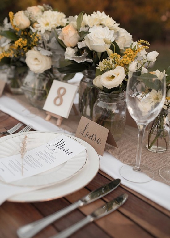 Elegant rustic wedding table setting with floral decor