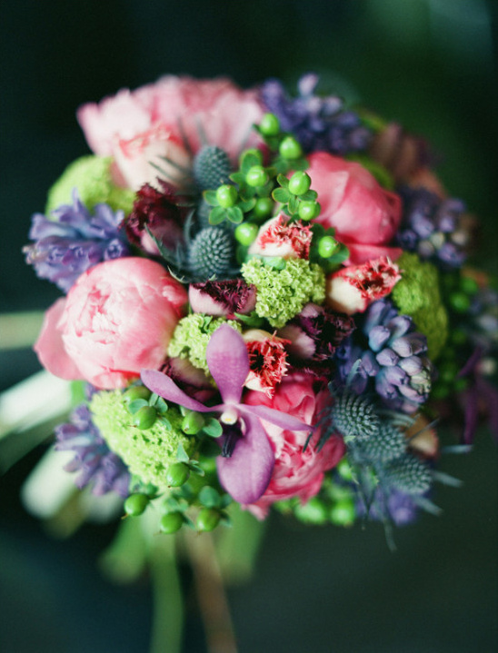 Vibrant bouquet with pink peonies and purple flowers, a beautiful floral arrangement